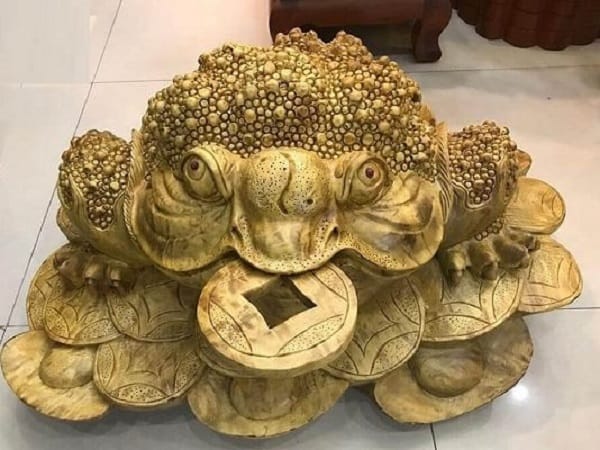 Ý nghĩa phong thủy của cóc ngậm tiền